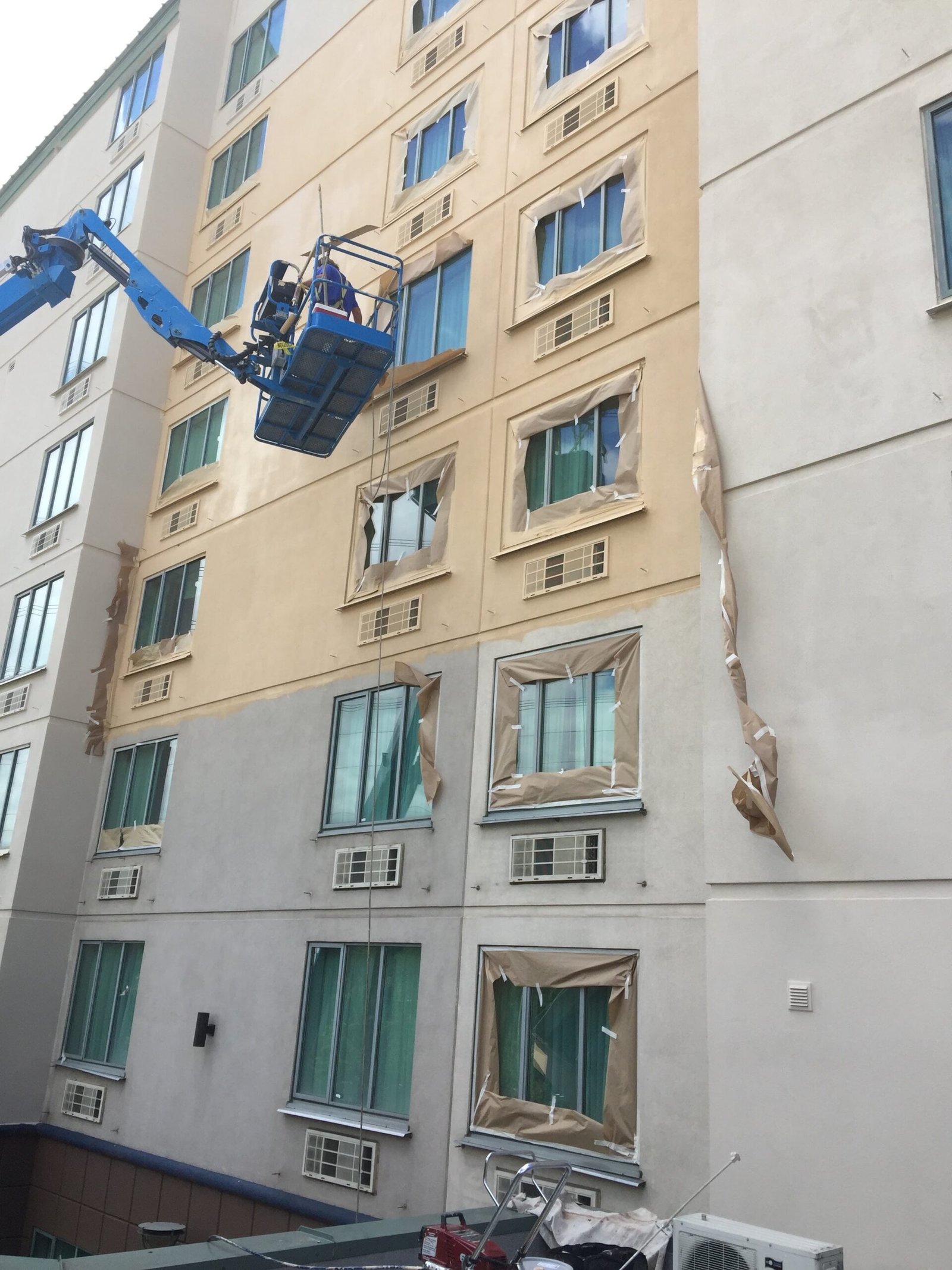 Hotel exterior painting from a lift