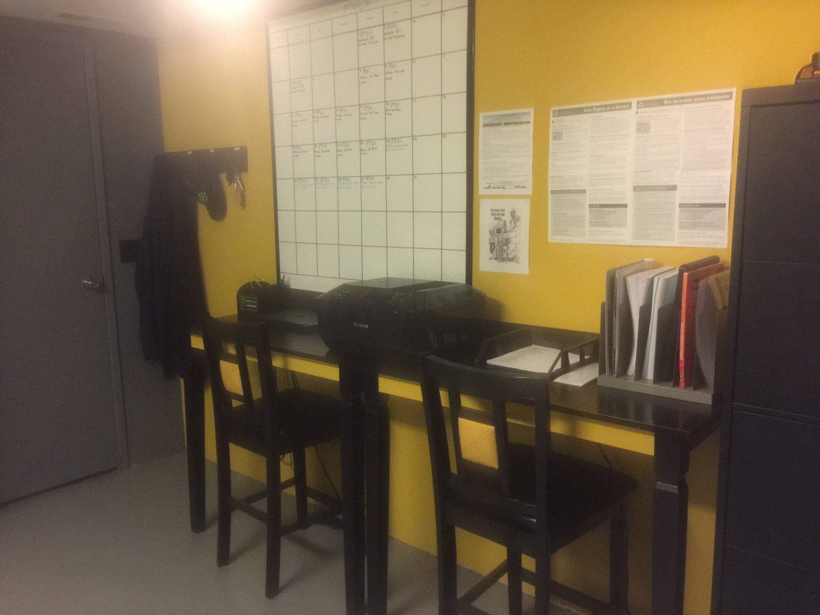 Finished yellow and charcoal office walls