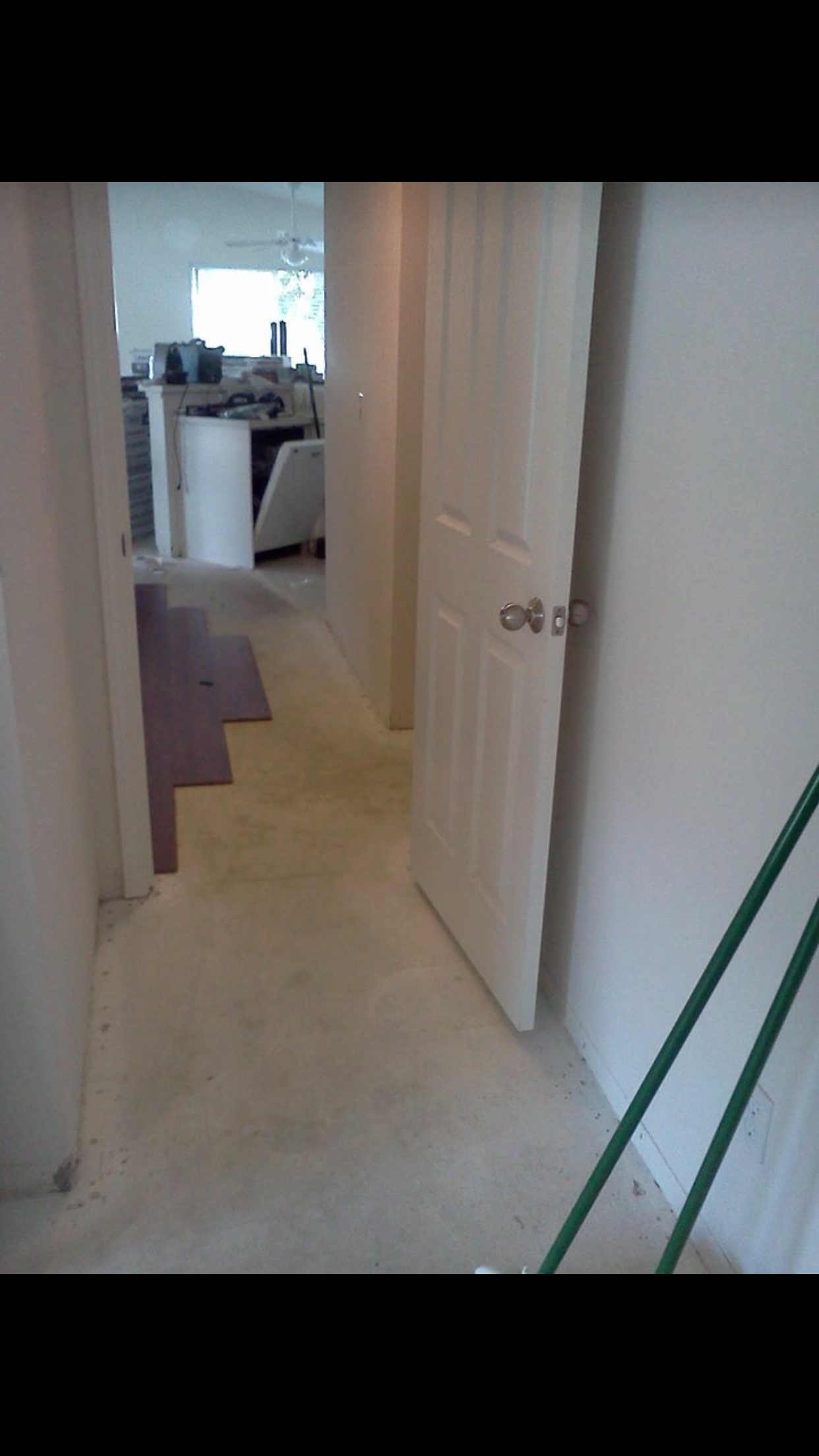 Carpet removed and new flooring installation started