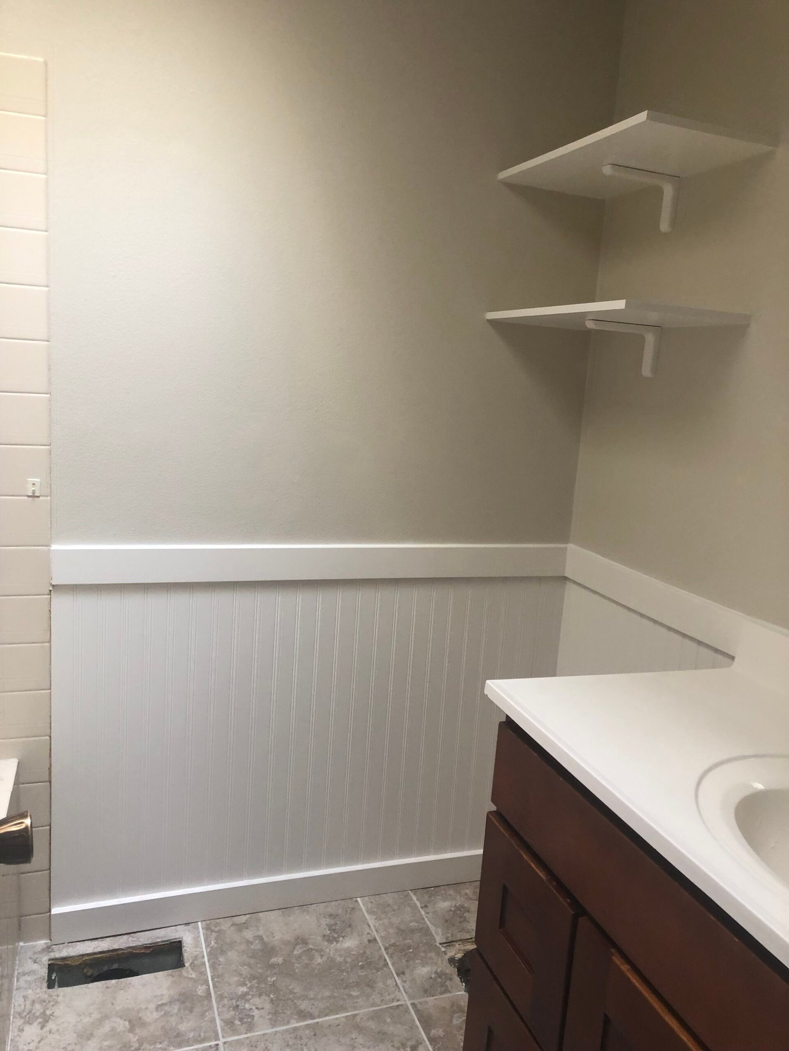 Finished bathroom wall and shelving