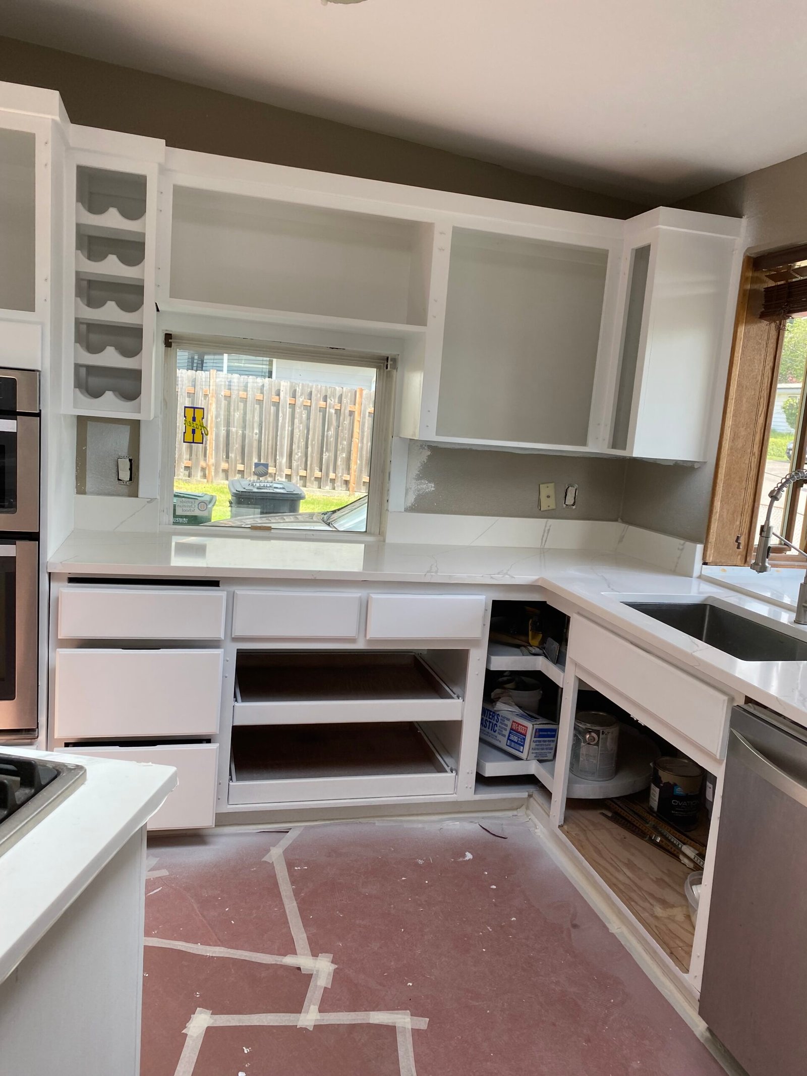 Raised-panel cabinet refinishing in progress